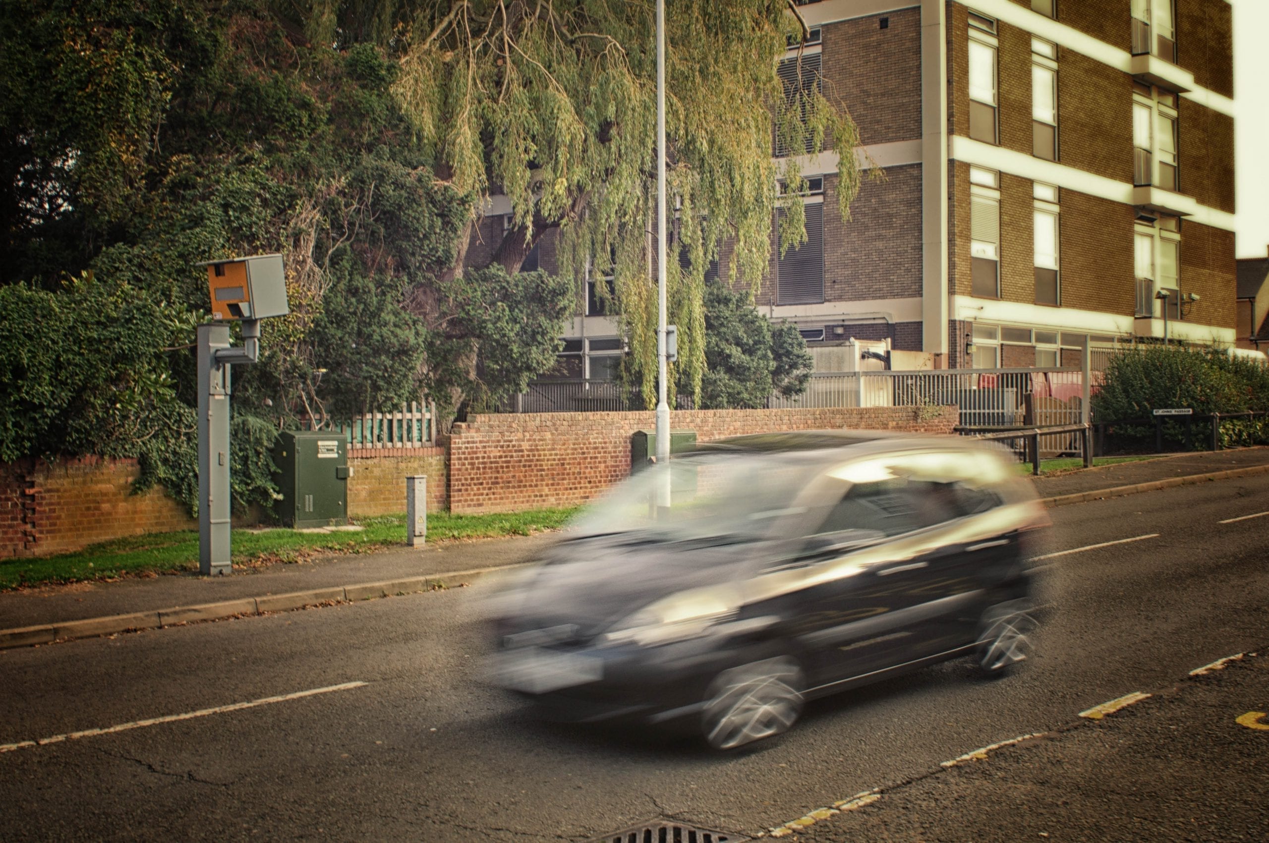 Black car and speed camera