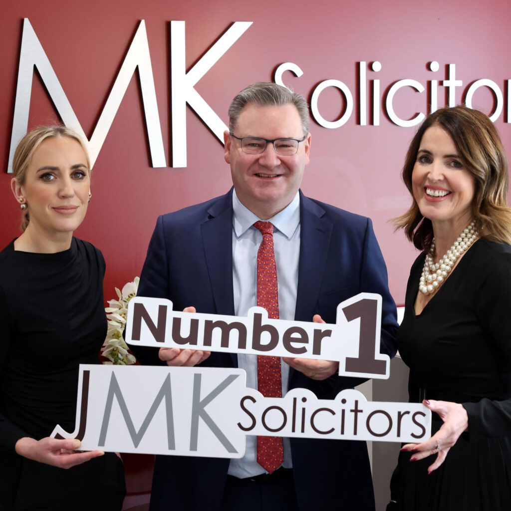 JMK Solicitors Number 1 - Jonathan McKeown, Olivia Meehan and Maurece Hutchinson pictures with the JMK Logo
