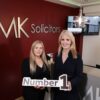 JMK Solicitors leadership team celebrating 12 years as Northern Ireland’s top personal injury law firm.